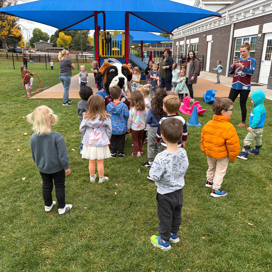 Young Avalanche fan smiling at an event